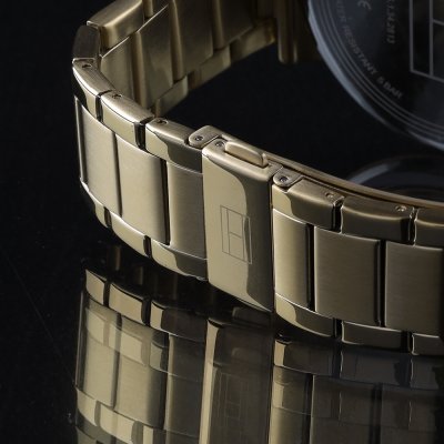 Gold-tone steel bracelet and clasp detail of Tommy Hilfiger Daniel watch
