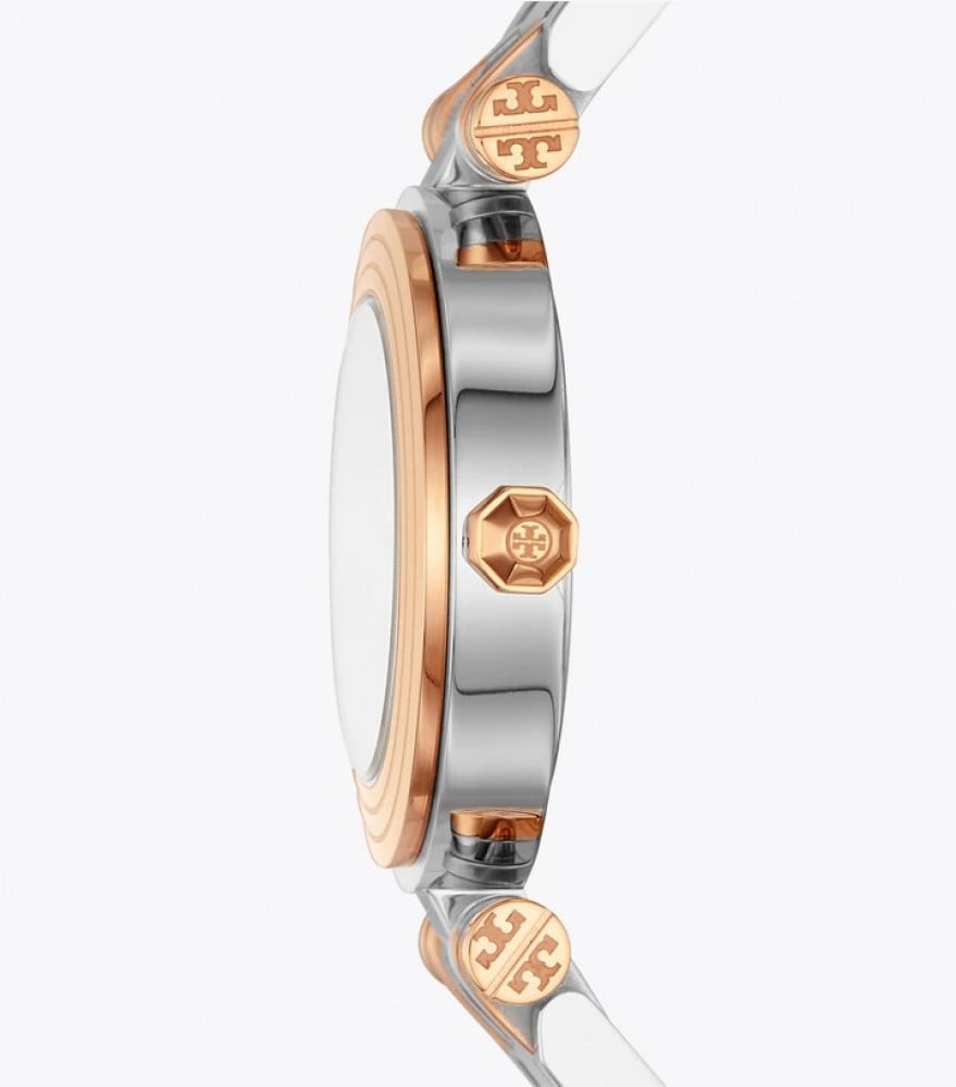 Side view of two-tone Tory Burch Classic T watch showing rose gold case bezel and silver stainless steel band