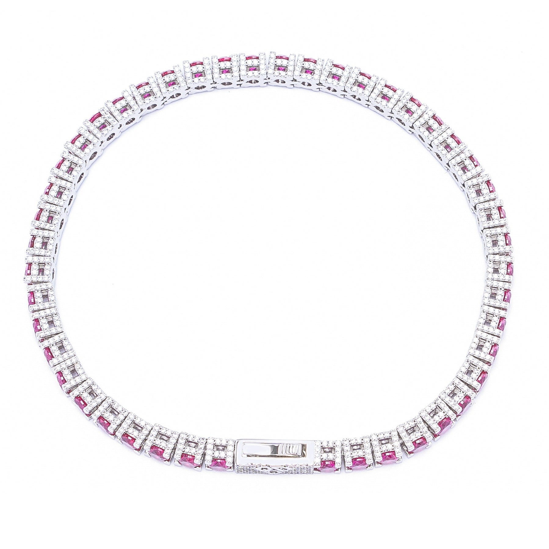 Silver ruby tennis bracelet laying flat showing alternating diamond and ruby square stone pattern