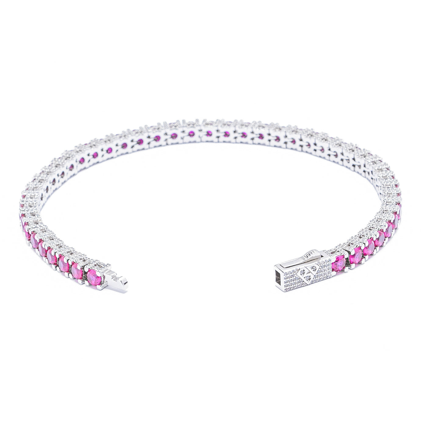 Silver ruby tennis bracelet with princess-cut ruby links and diamond halo settings, angled view