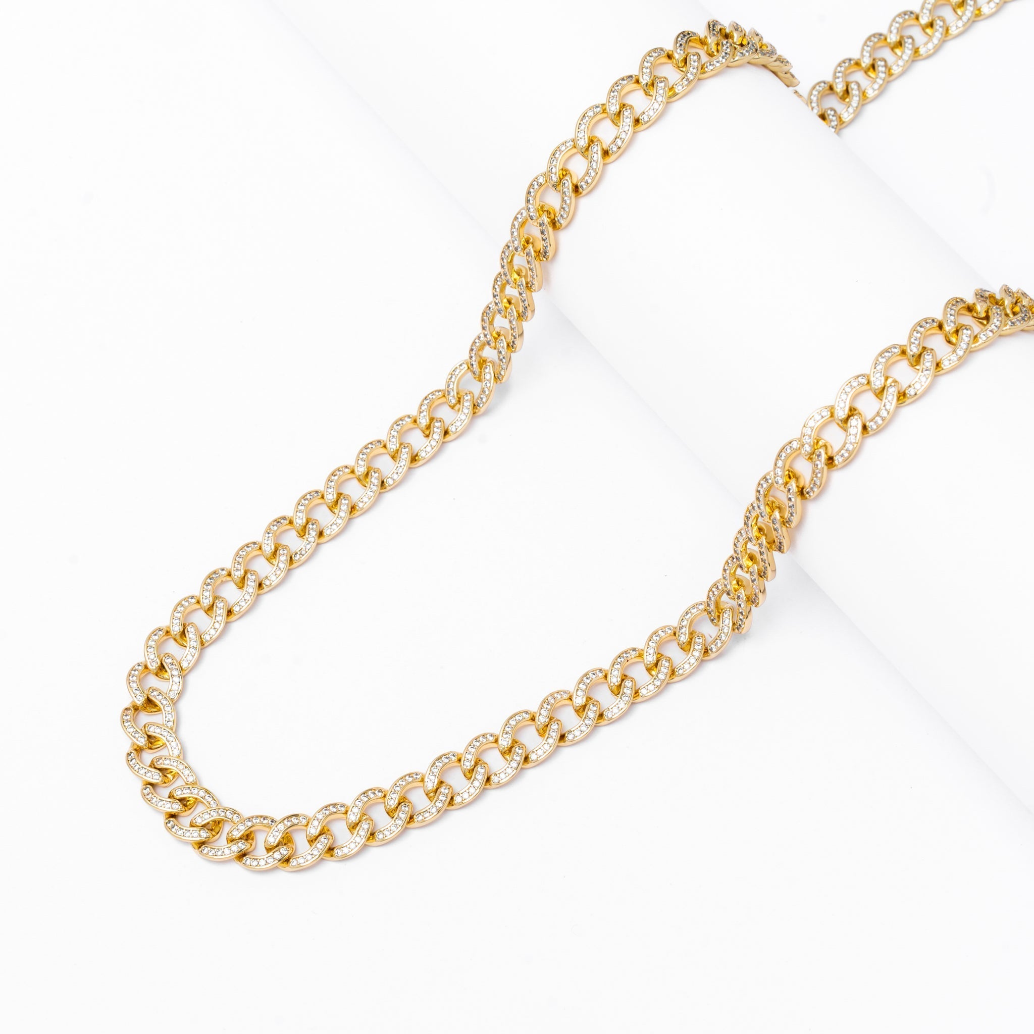 Two 8MM iced Cuban gold chains laid out showing full length and link pattern