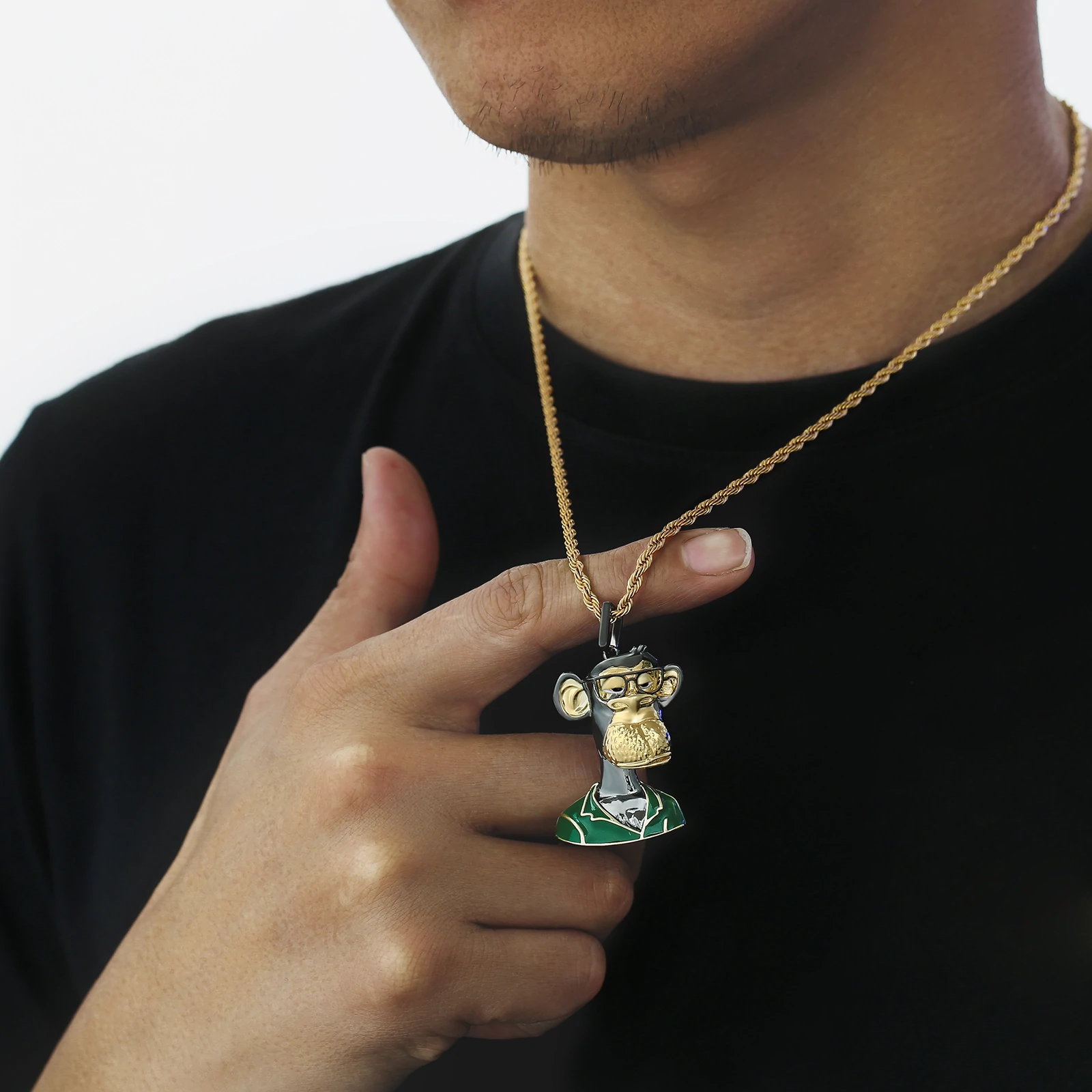 Big Daddy Bored Ape NFT Pendant #9 held in hand on gold chain necklace