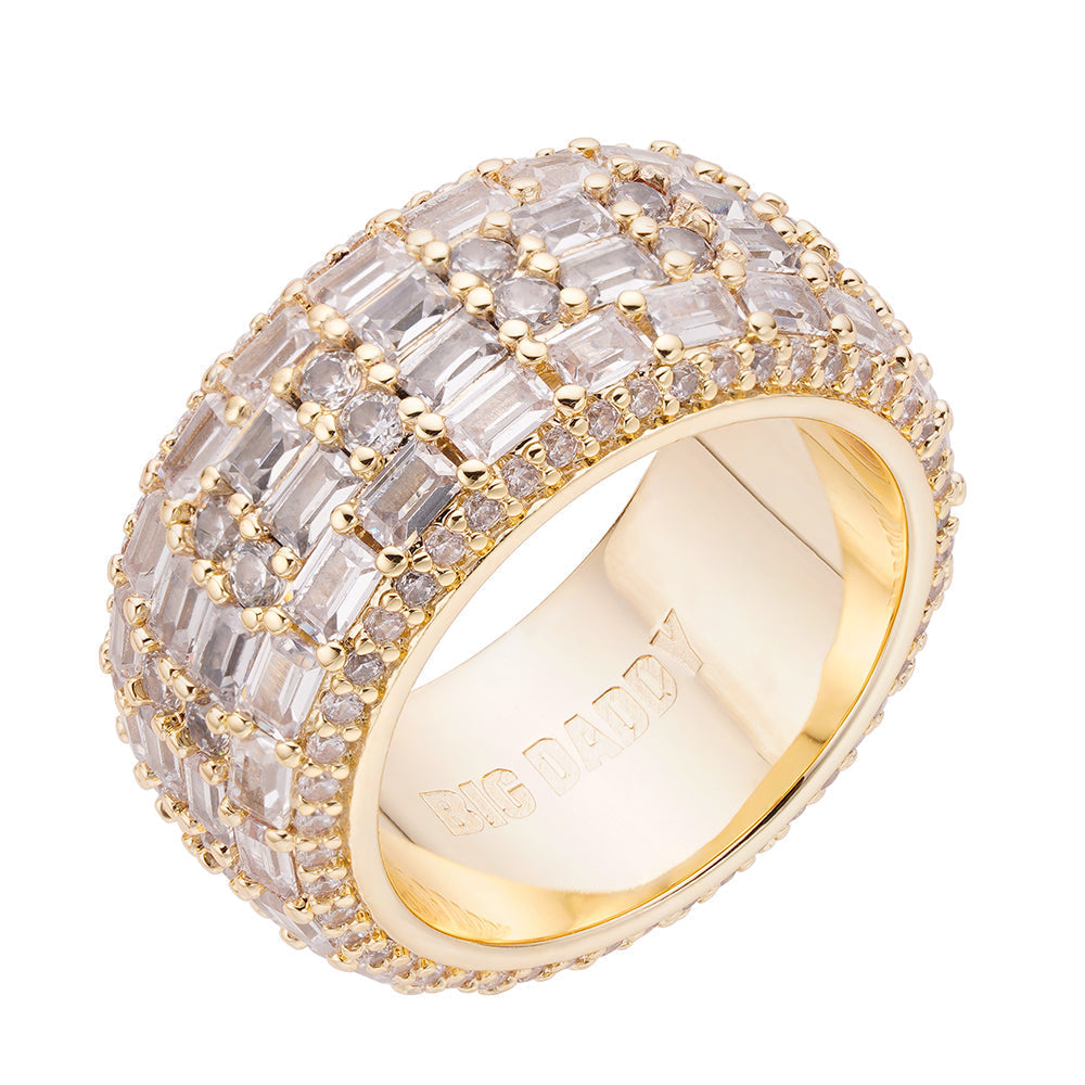 Gold baguette and round diamond iced out ring on white background