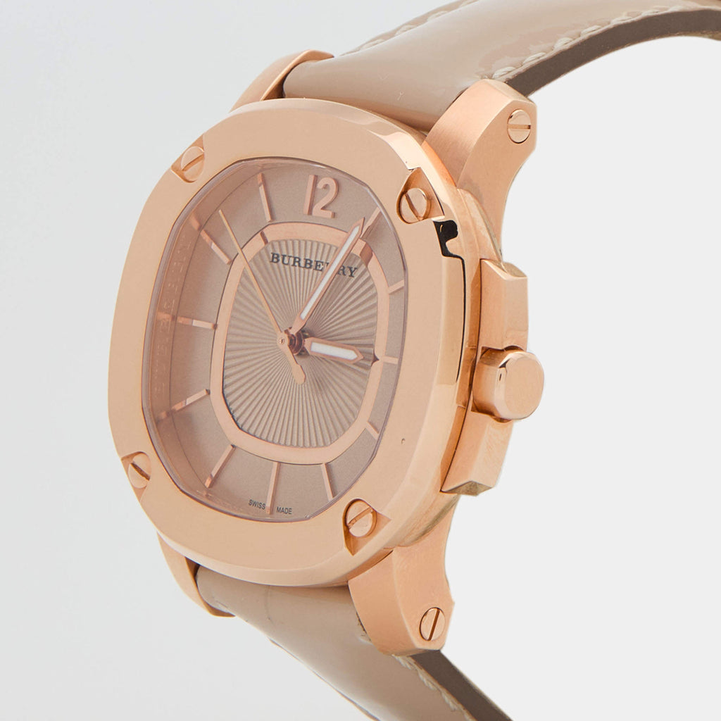Three-quarter view of Burberry The Britain rose gold case with storm grey dial