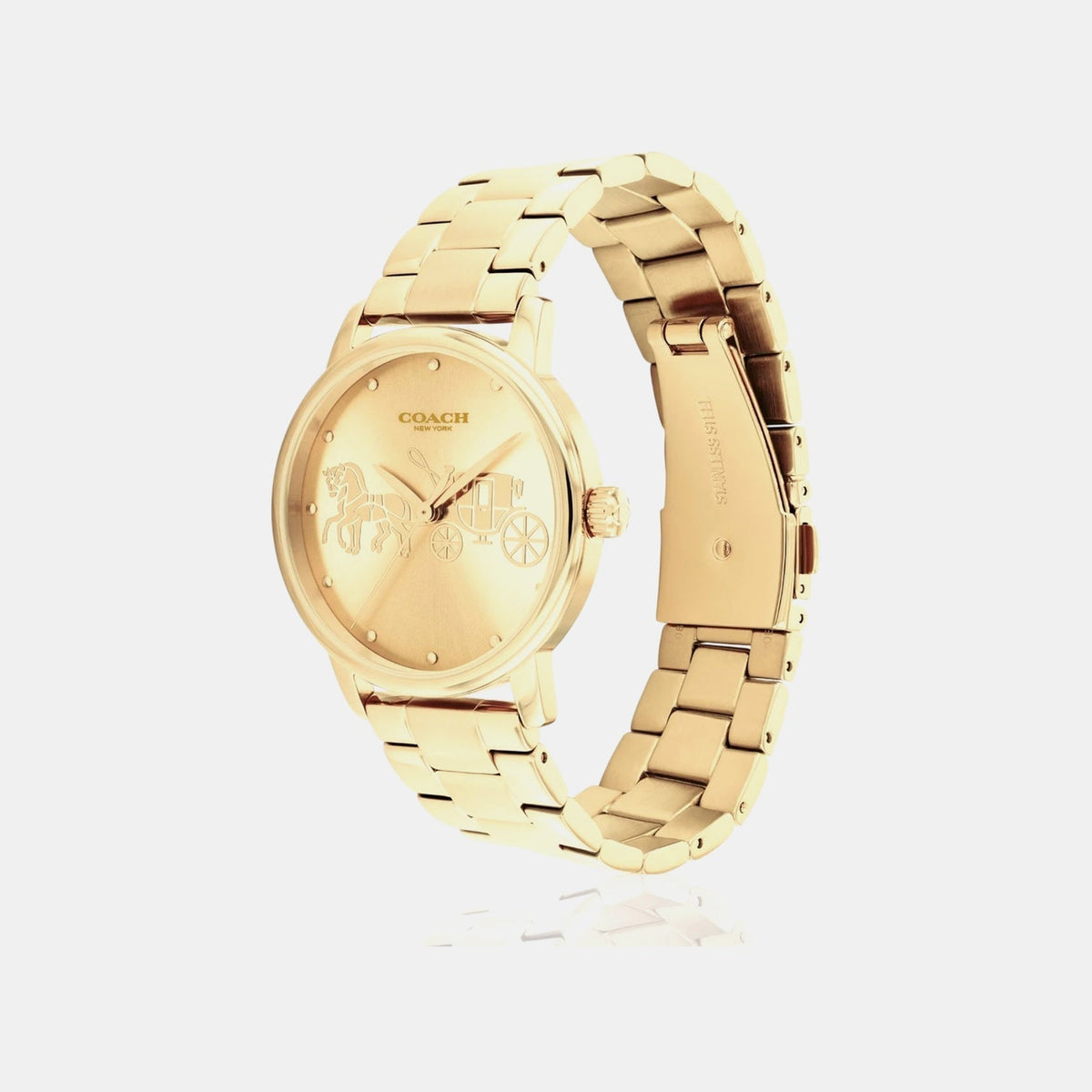 Coach Grand ladies watch angled view showing gold bracelet and champagne dial