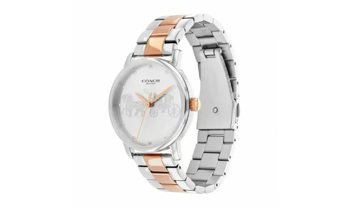 Coach Grand Carriage watch shown at angle displaying silver dial and mixed metal bracelet