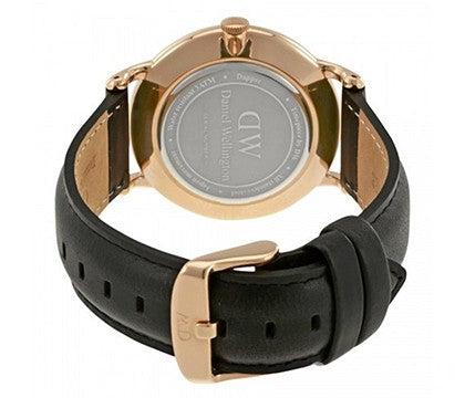 Caseback of Daniel Wellington Dapper Sheffield showing engraved text and gold case with black leather strap