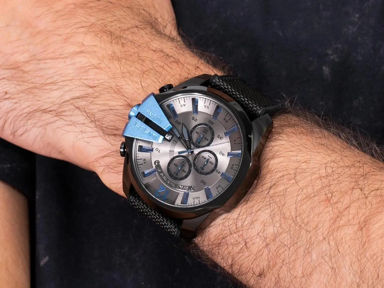 Diesel Mega Chief DZ4500 chronograph watch worn on wrist showing grey dial and blue accents