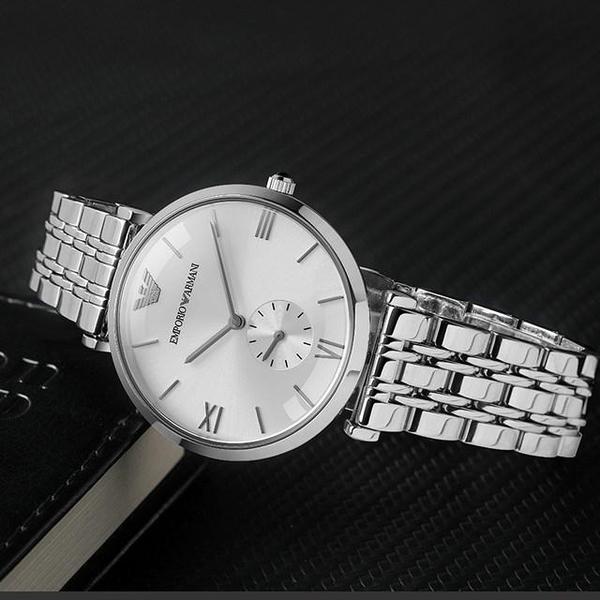AR1819 watch on dark surface with Roman numeral indices visible