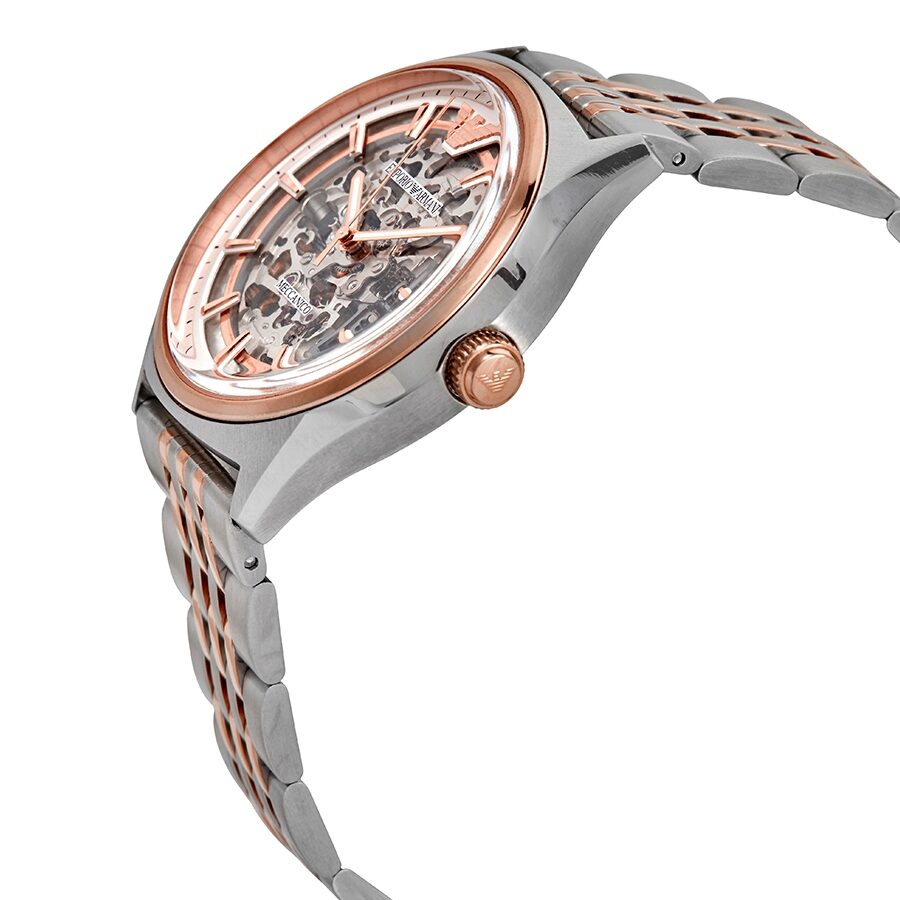 Side angle view of Emporio Armani Meccanico skeleton watch showing two-tone bracelet and rose gold crown