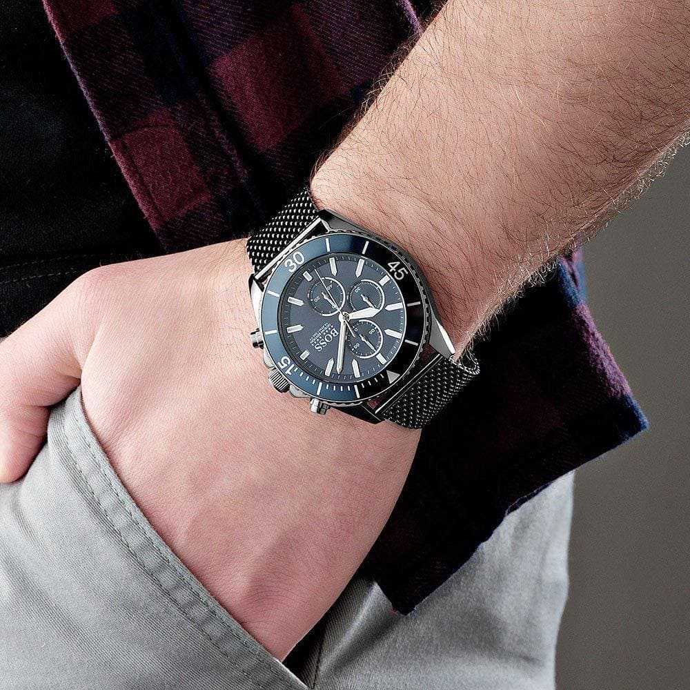 Hugo Boss Ocean Edition chronograph watch worn on wrist showing navy dial and mesh bracelet