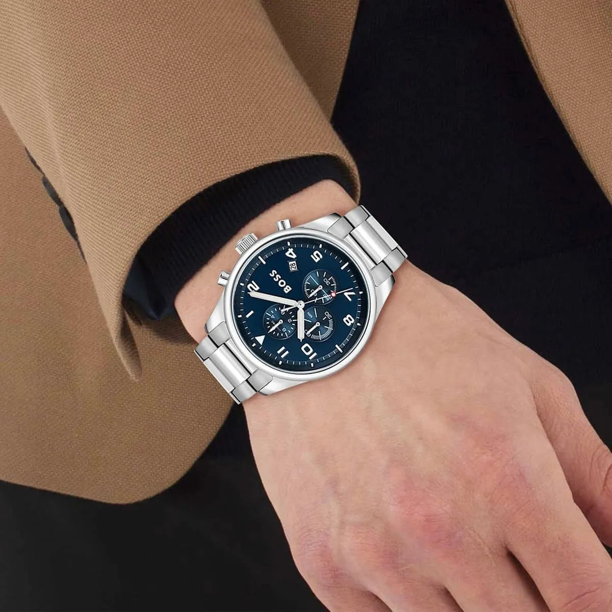 Hugo Boss View watch worn on wrist with blue dial and silver bracelet visible