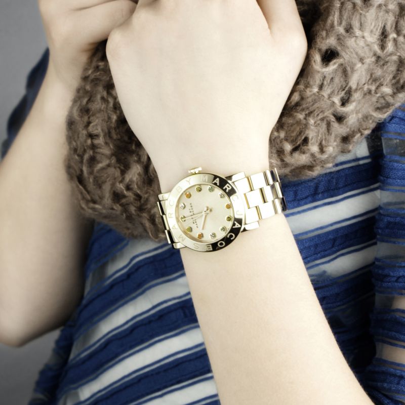 Marc by Marc Jacobs Blade watch worn on wrist with gold-tone case and bracelet