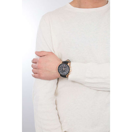 Maserati Circuito watch worn on wrist with black dial and rose gold case visible on cream-colored sleeve