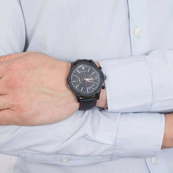 Maserati Circuito chronograph watch worn on wrist with light blue shirt