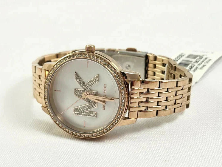 Michael Kors Adrianna II rose gold watch on wrist with crystal-studded bezel