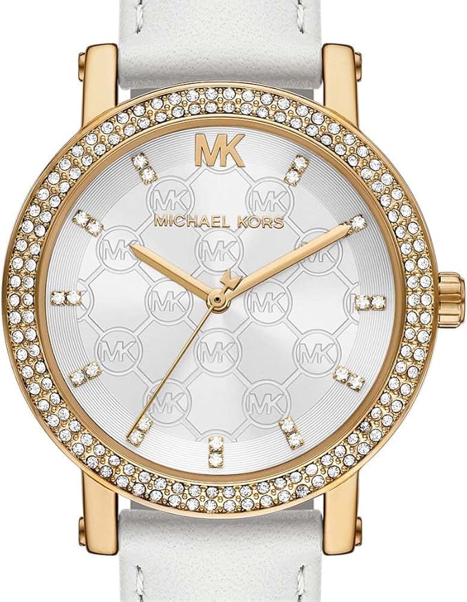 Close-up of Michael Kors Corey watch dial with MK logo, hour markers, and three-hand movement
