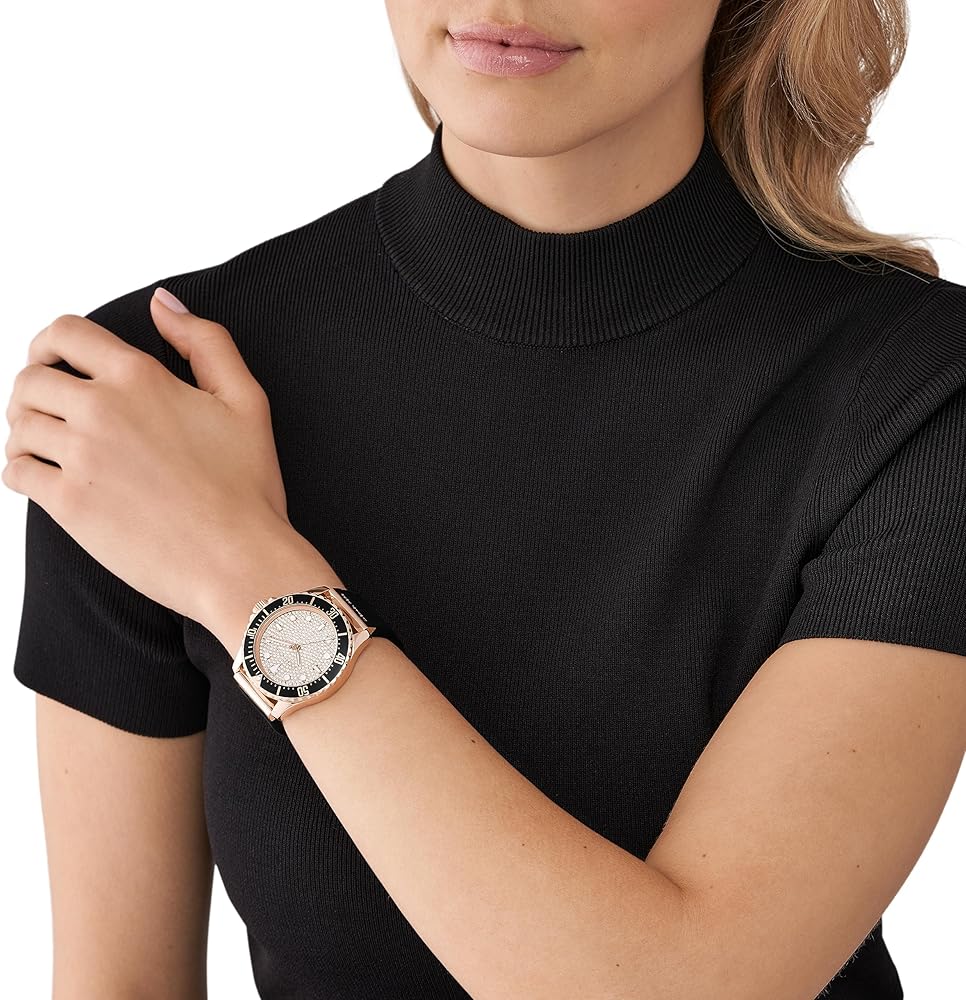 Michael Kors Everest rose gold pavé watch worn on wrist with black strap