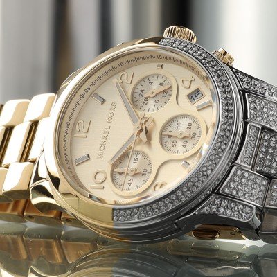 Close-up of MK7329 dial showing chronograph subdials and Arabic numerals
