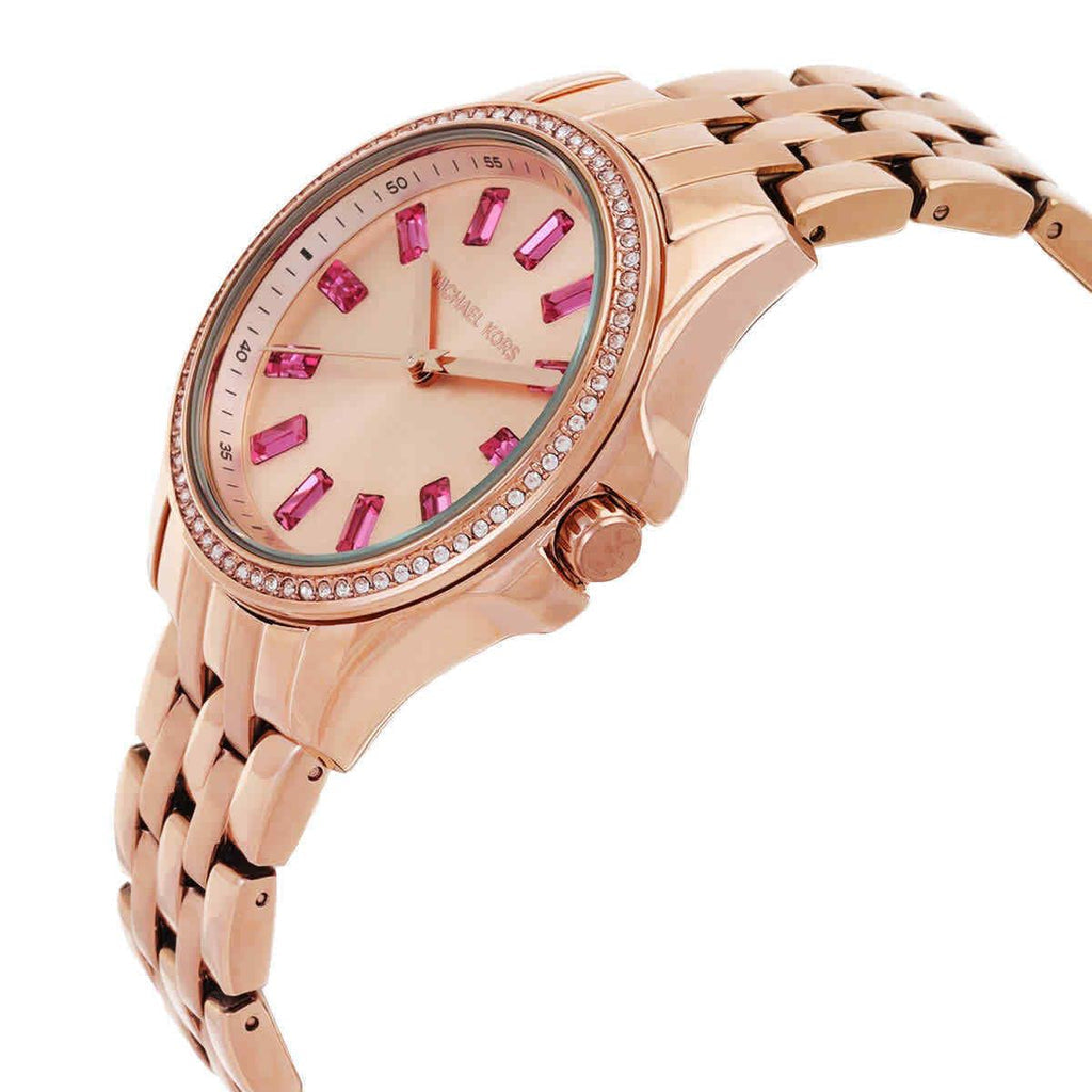 Michael Kors MK7367 rose gold watch at angle showing crystal markers and linked bracelet