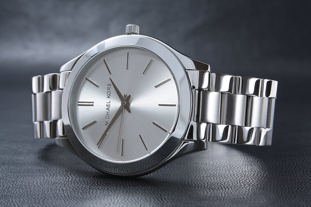 Michael Kors Runway watch angled view showing silver dial and steel bracelet