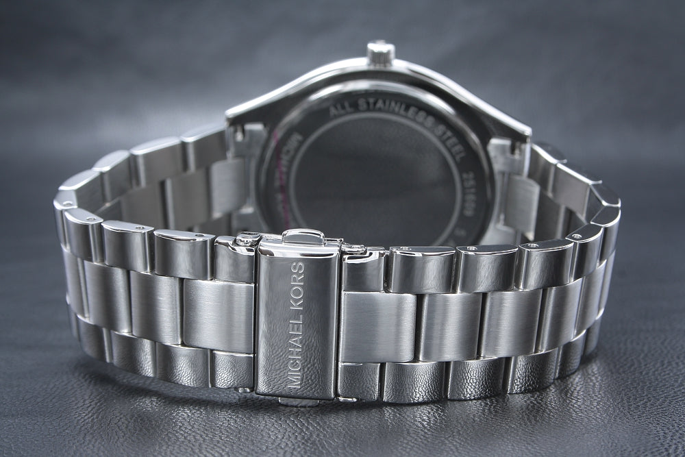 Michael Kors Runway watch case back showing stainless steel and Michael Kors branding