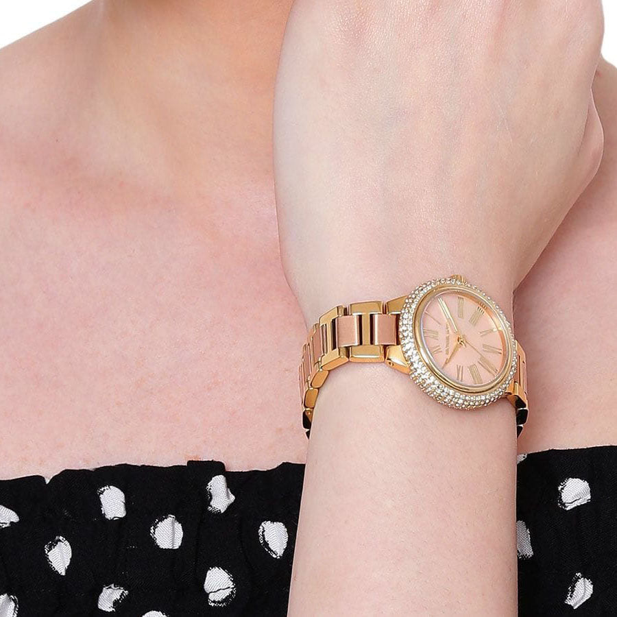 Michael Kors Taryn MK6564 watch worn on wrist with two-tone bracelet and crystal bezel