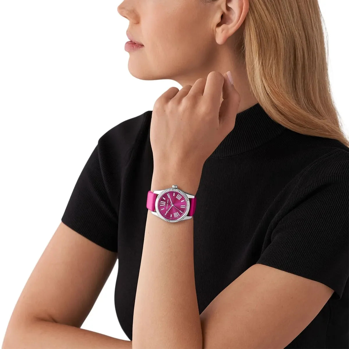Michael Kors Lexington watch worn on wrist with magenta dial and pink leather band