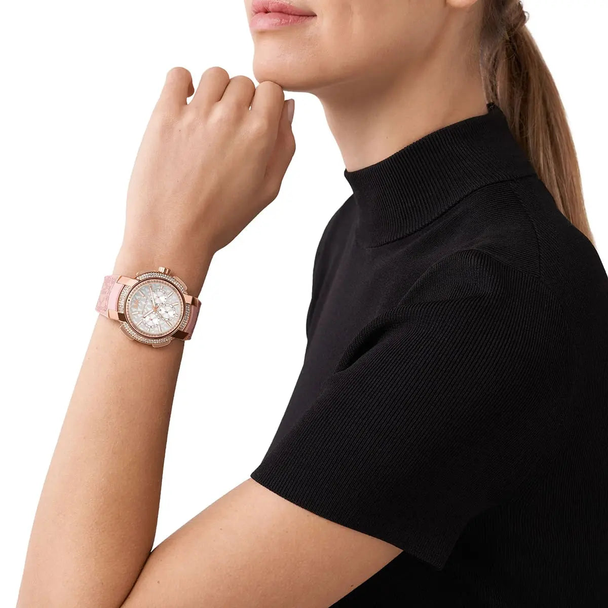 Michael Kors Sidney watch worn on wrist with crystal bezel and white dial visible