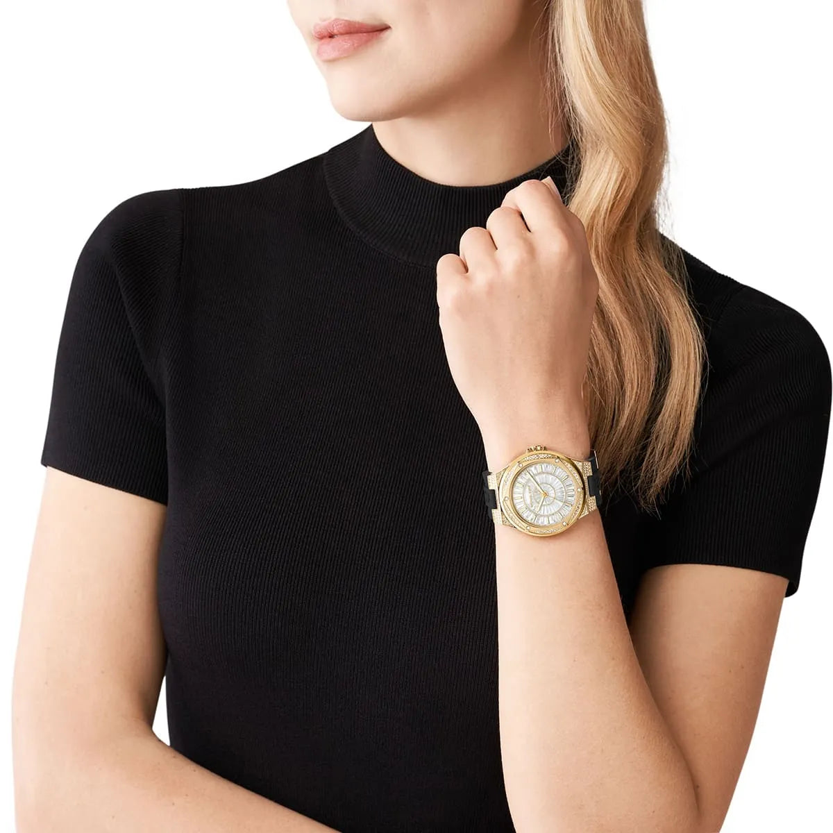 Michael Kors Lennox women's watch worn on wrist with gold case and crystal-set bezel