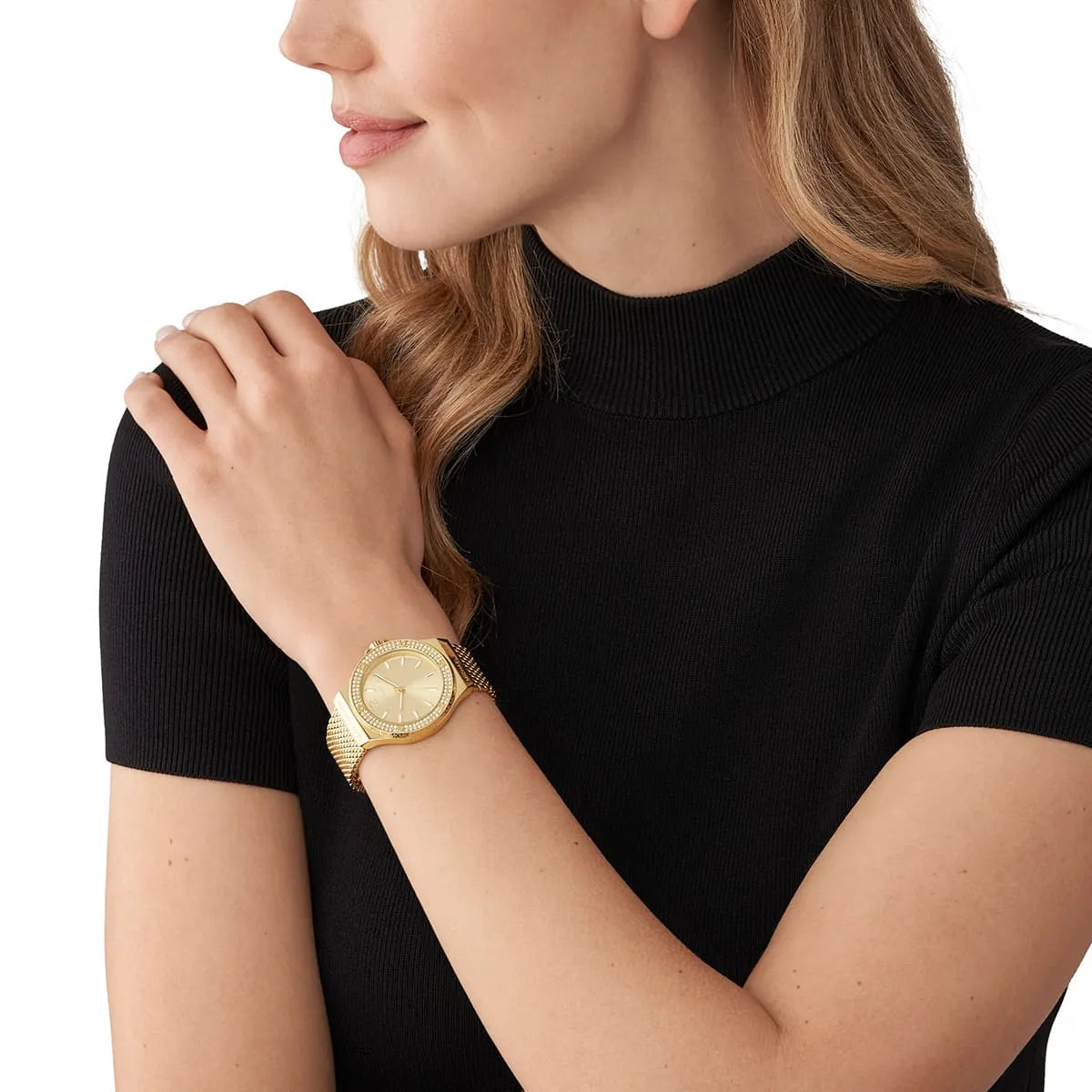Michael Kors Lennox watch worn on wrist showing gold-tone case and mesh band