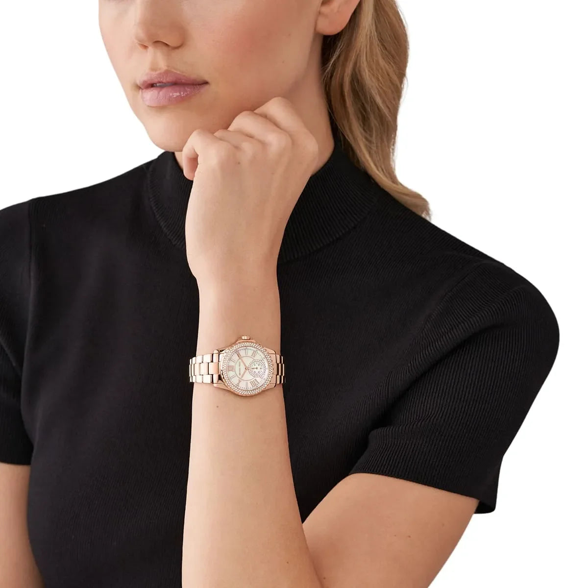 Michael Kors Mini Everest rose gold watch worn on wrist with white mother-of-pearl dial
