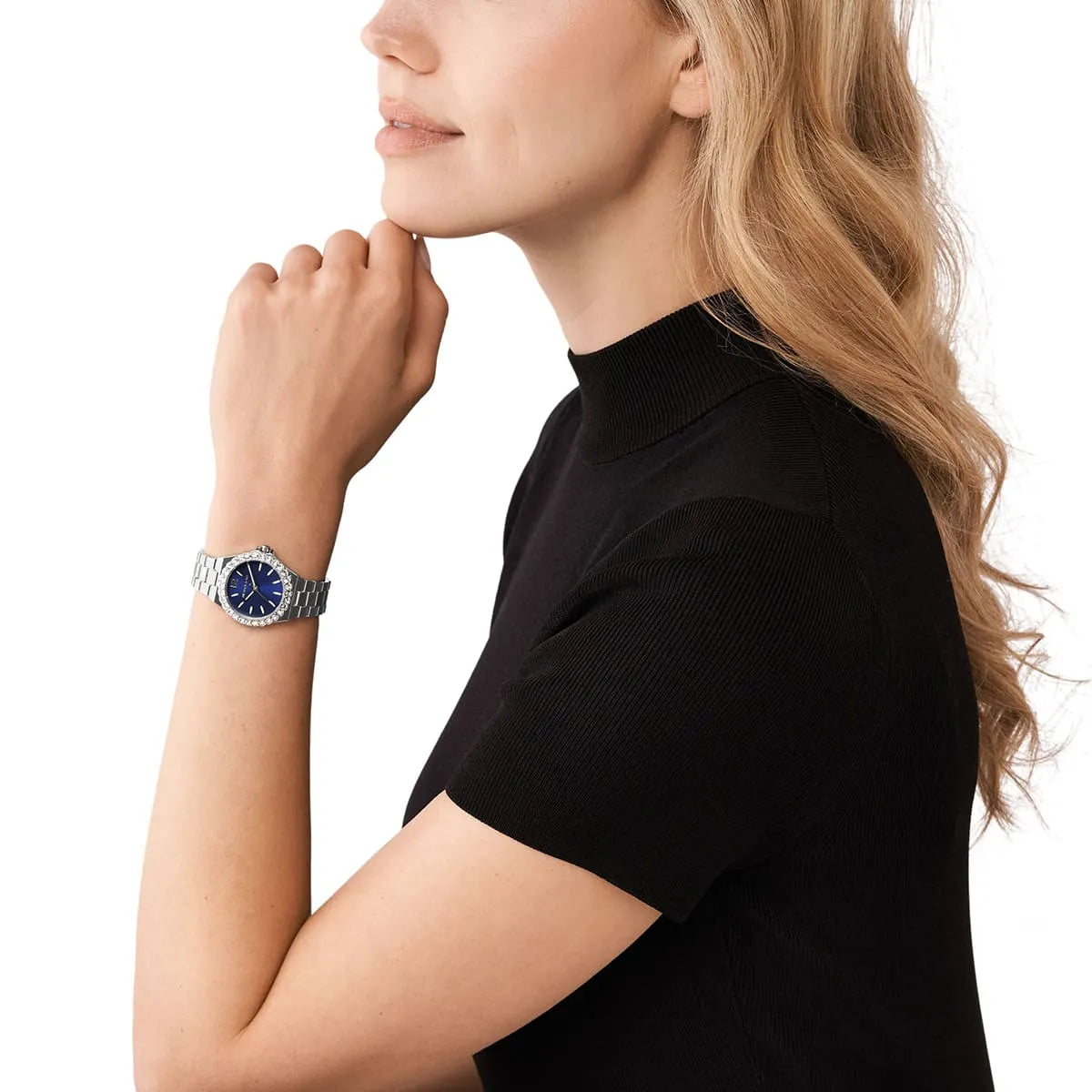 Michael Kors Mini Lennox watch worn on wrist showing blue dial and silver bracelet