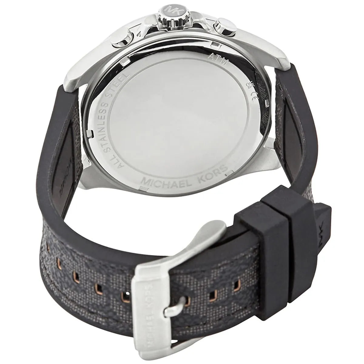 Caseback of Brecken chronograph watch with Michael Kors branding and black rubber strap visible