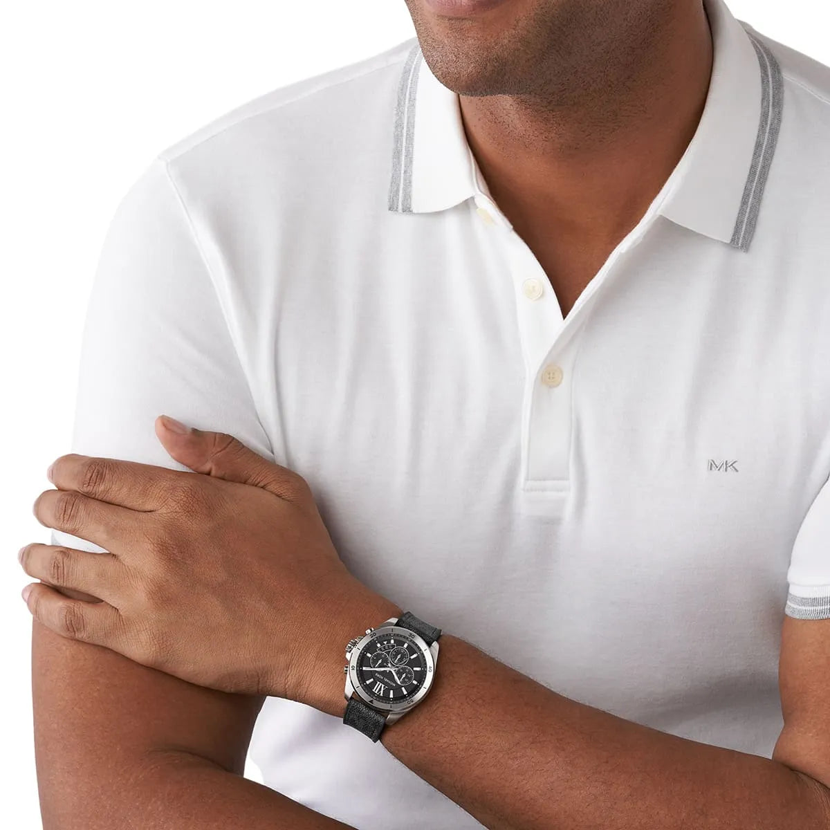 Brecken chronograph watch worn on wrist with black dial and silver case on black strap