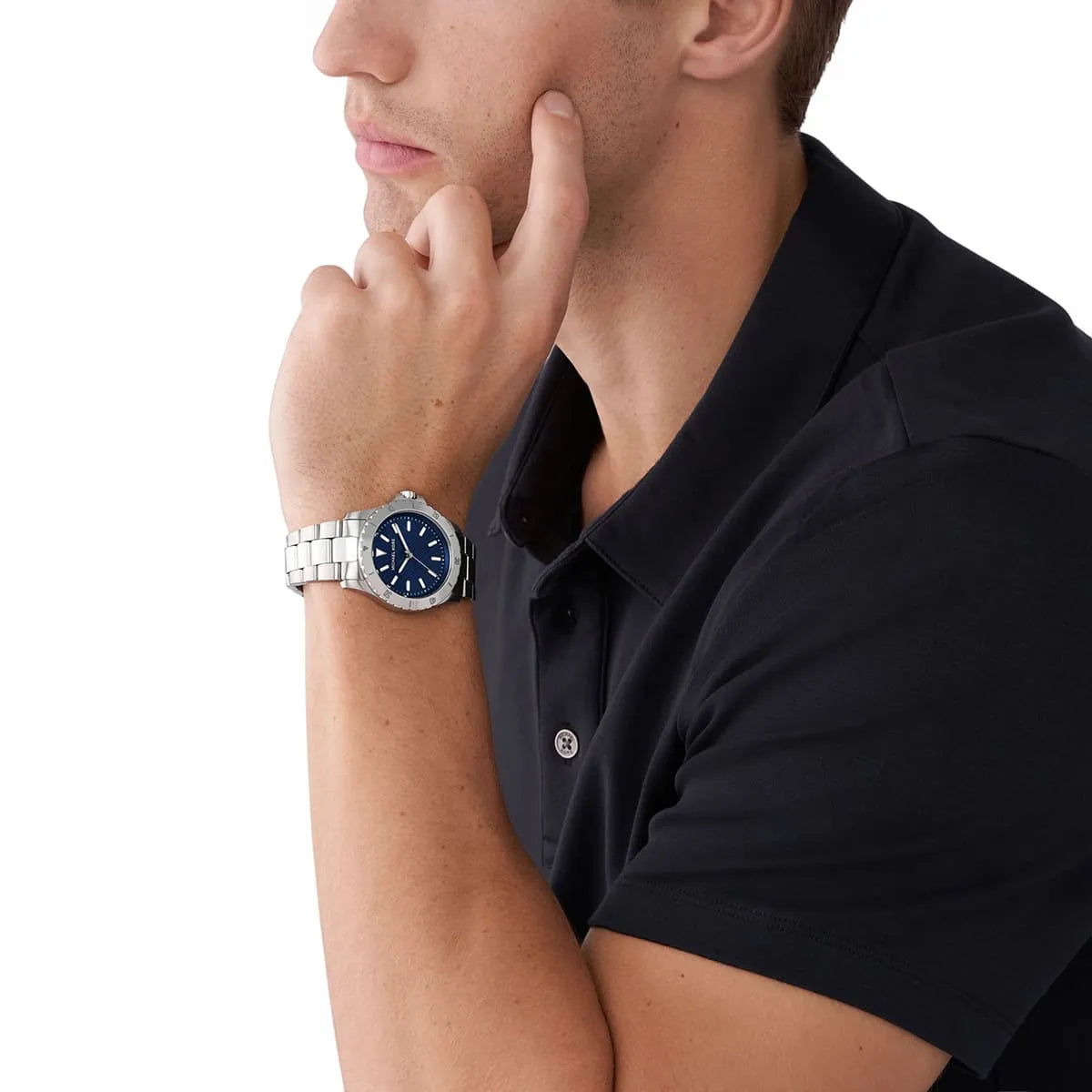 Michael Kors Everest MK9079 men's watch worn on wrist with blue dial and silver bracelet