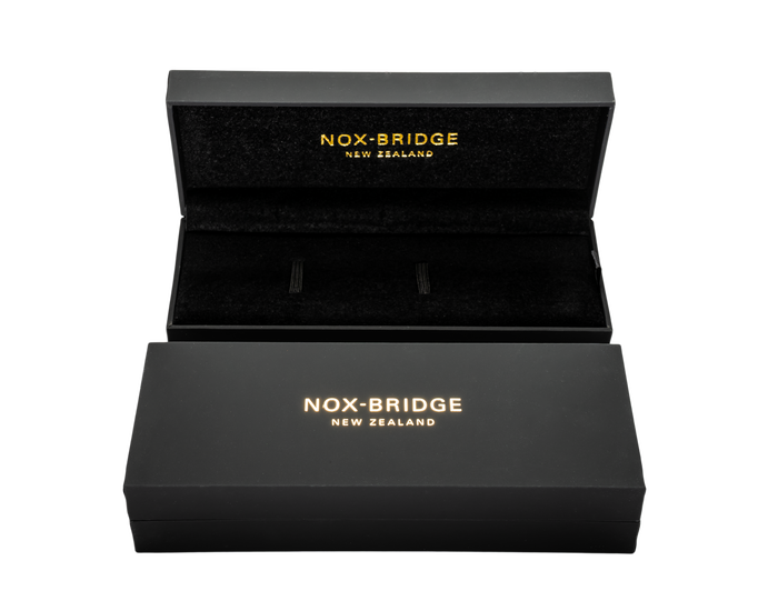 Noxbridge black packaging box with gold logo text and open lid display