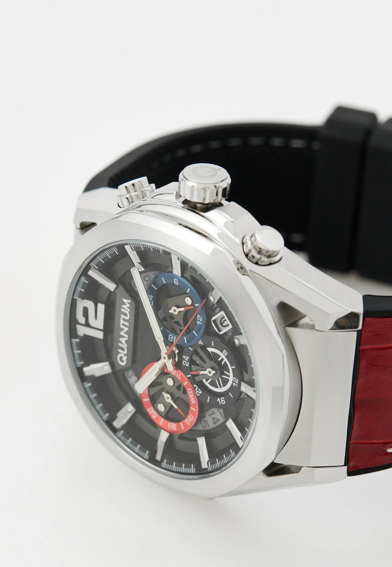 Three-quarter angle view of Quantum watch with red silicon strap and pushers visible