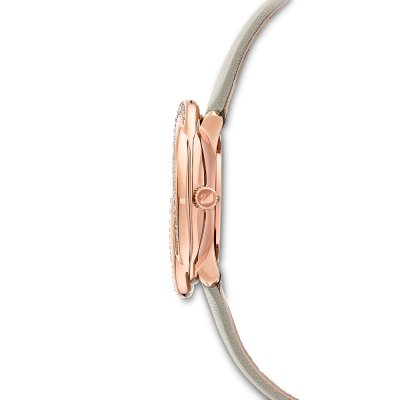Side profile of Swarovski Crystalline Aura watch showing rose gold case depth and cream strap