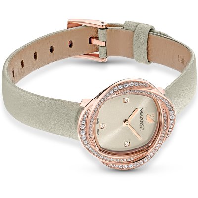 Swarovski Crystalline Aura watch with cream leather strap and rose gold buckle closure