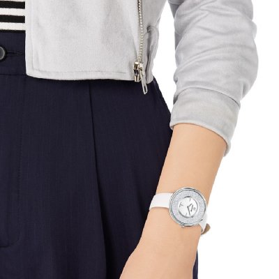 Swarovski Graceful Lady watch worn on wrist showing white strap and crystal-filled bezel