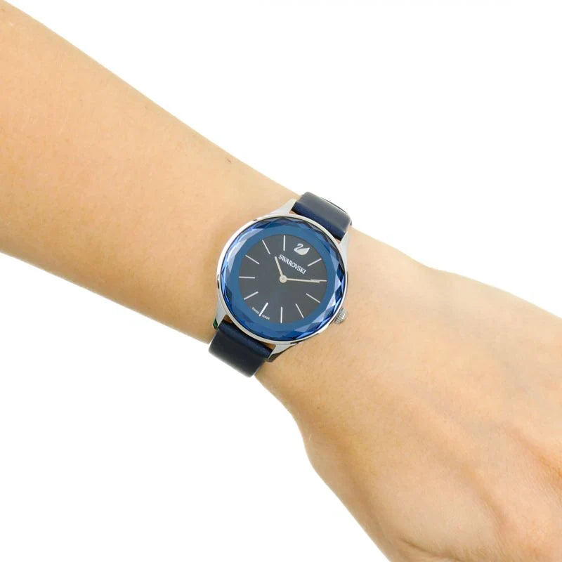 Swarovski Octea Nova women's watch on wrist showing blue faceted bezel and dial