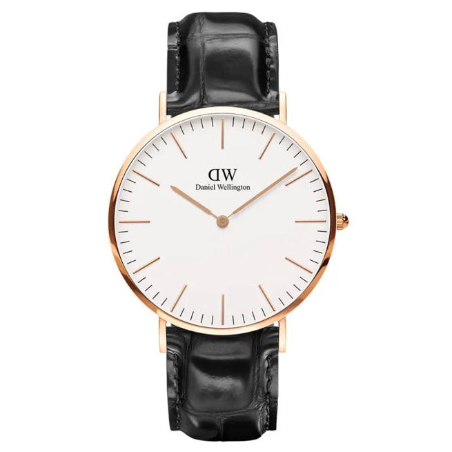 Daniel Wellington wristwatch with a round white dial, rose gold case, and black alligator leather strap, shown against a plain white background.