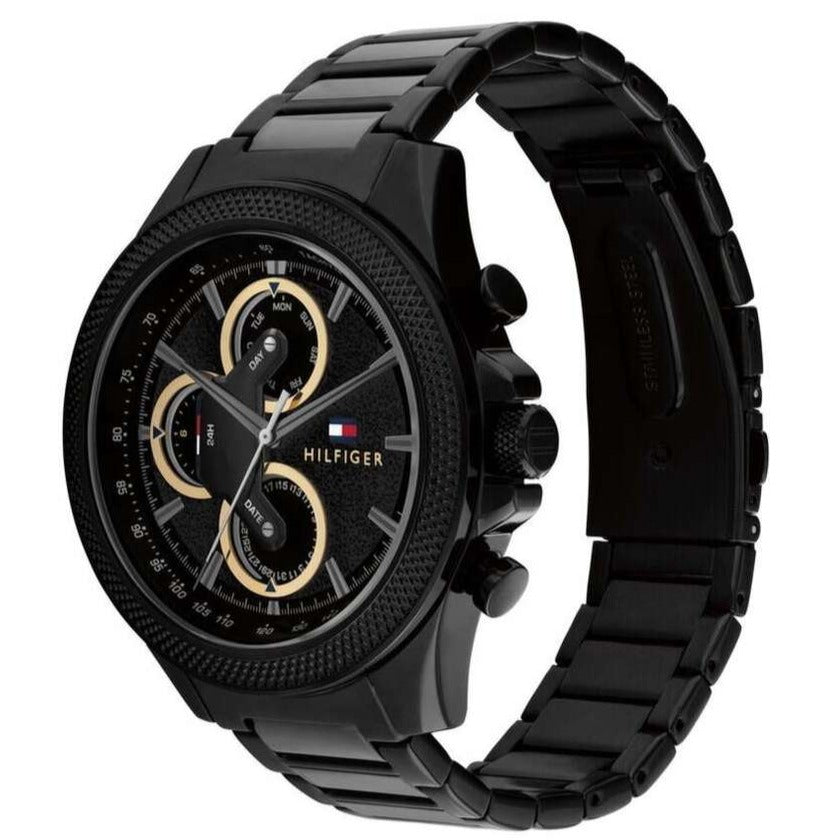 Tommy Hilfiger Damon watch angled view showing black case and metal bracelet with chronograph dial