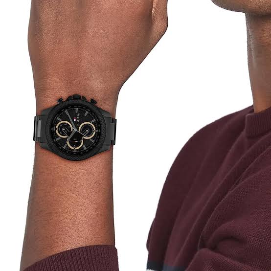 Tommy Hilfiger Damon black chronograph watch worn on wrist, close-up view