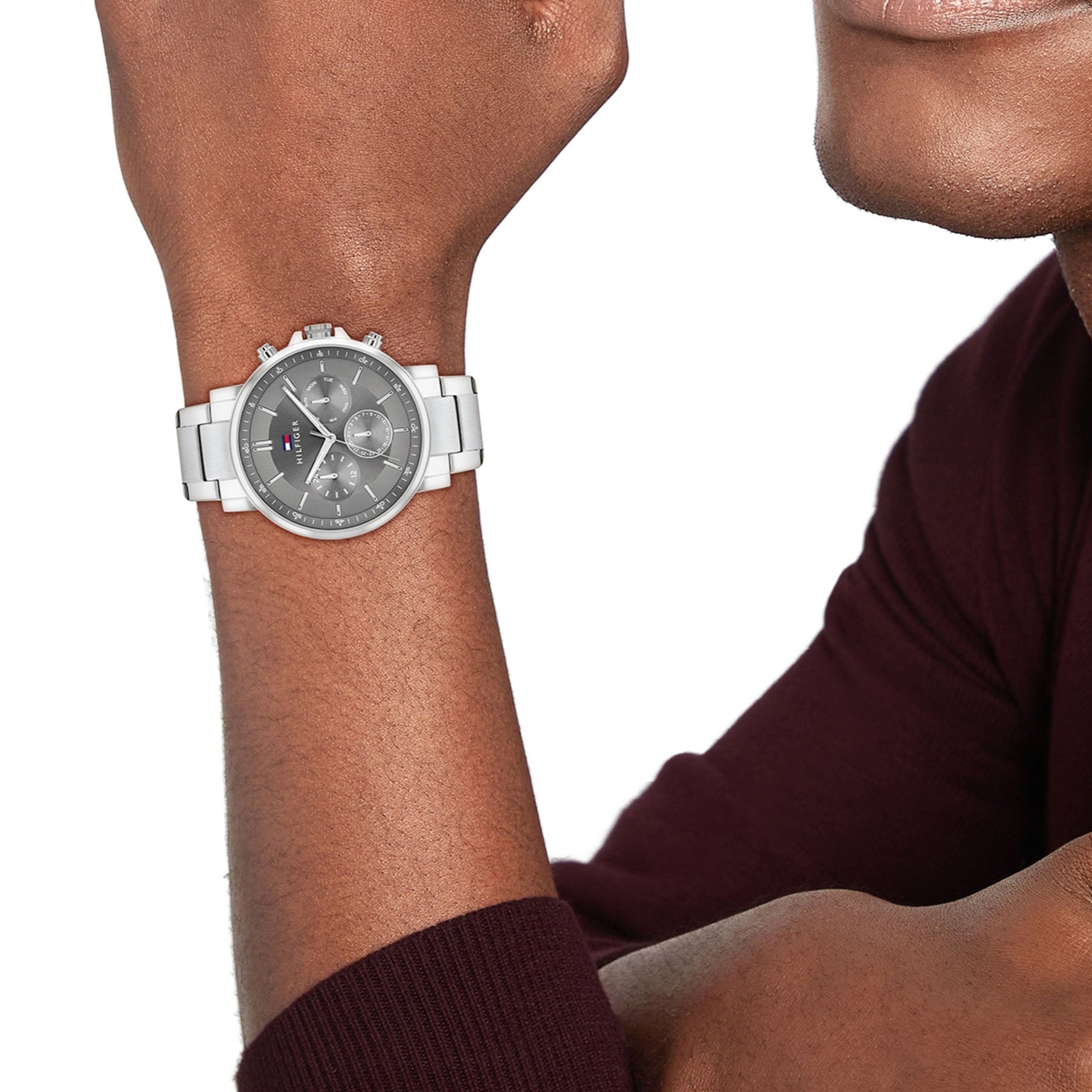 Tommy Hilfiger Tyson chronograph watch worn on wrist showing dark grey multi-function dial
