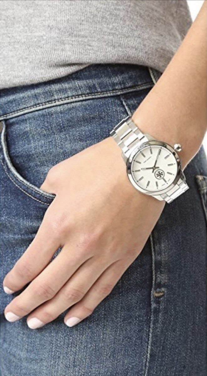 Tory Burch Collins women's watch on wrist with denim and neutral top