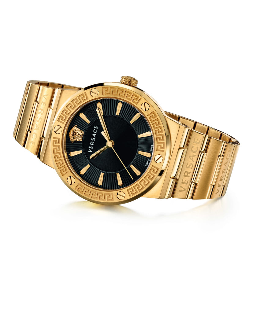 Versace Greca women's watch on wrist, gold steel bracelet and black dial visible