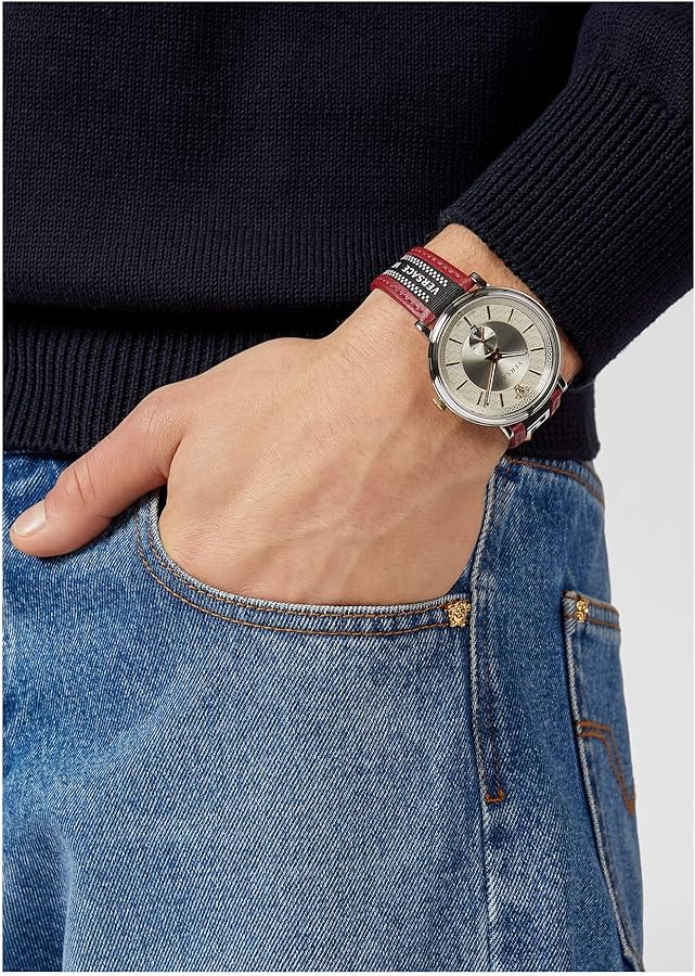 Versace V Circle watch worn on wrist with navy sweater and denim